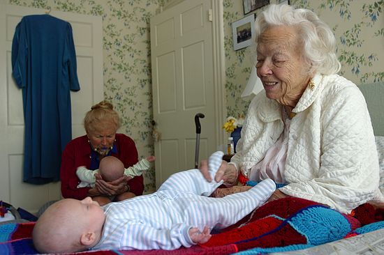 Granny Jean giggles with Gus while Lucinda keeps Zeke busy.