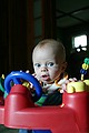 But he's wide awake behind the wheel of his exersaucer.