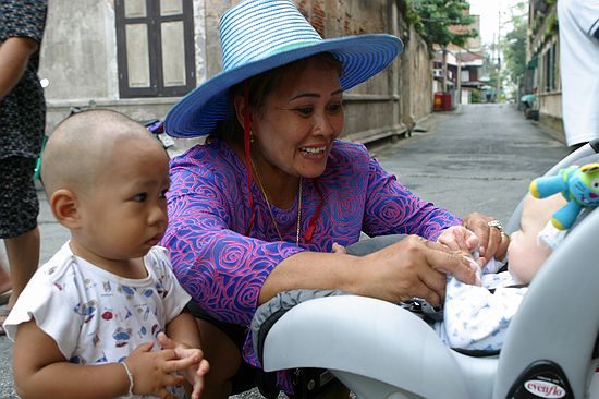 Zeke makes friends on the streets of Bangkok.