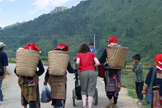 The asain women carry their loads.