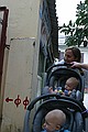 Wendy and the boys peek down an alley.