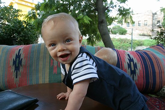 Zeke stretches his legs at an outdoor cafe.