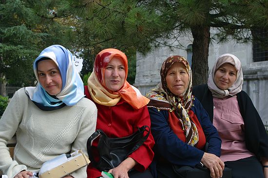 All these ladies were conerned that the boys were not dressed warmly enough.