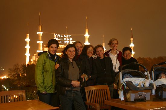 Conference attendees on a rainy rooftop.