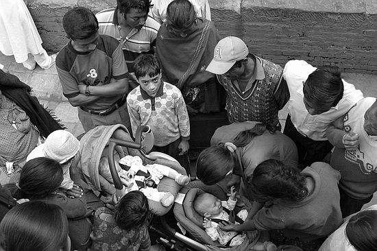 The boys attract a crowd in Kathmandu's Durbur Square.