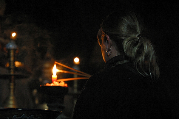 Allison lights some incense.