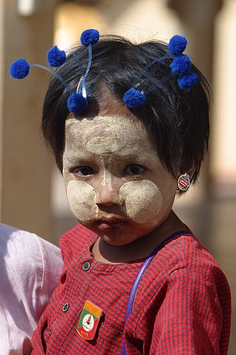 Little girl with baubles.