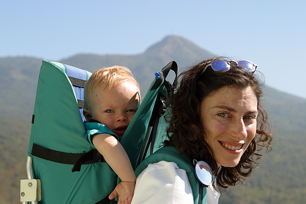 Amy totes Zeke up Mt. Popa.