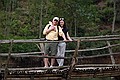 Mike and Amy cross a bridge.