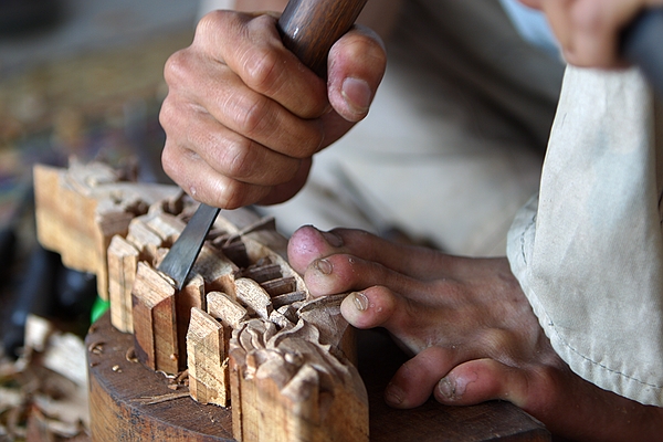 Carving wood.