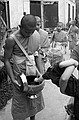 Zeke earns some merit by feeding the monks.