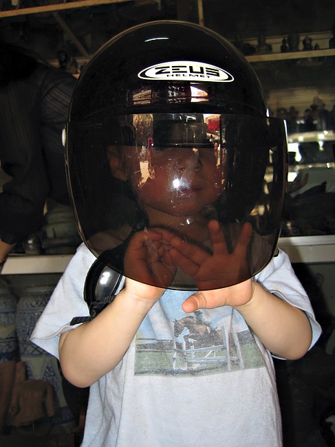 Gus tries a helmet on for size.