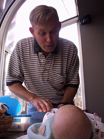 Uncle Ben changes a diaper.